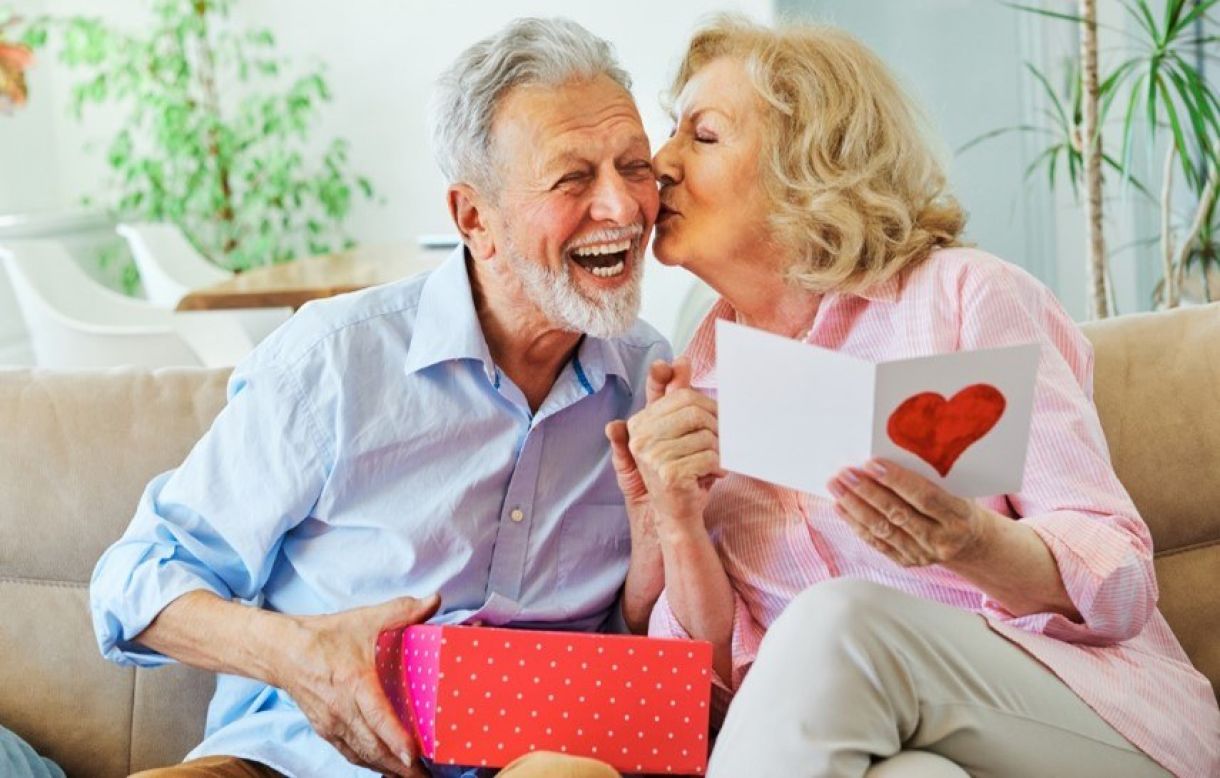 Old couple opening valentines day gifts