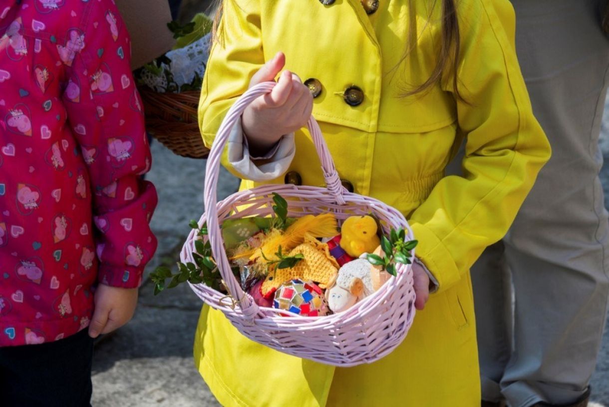 Child carrying easter basket